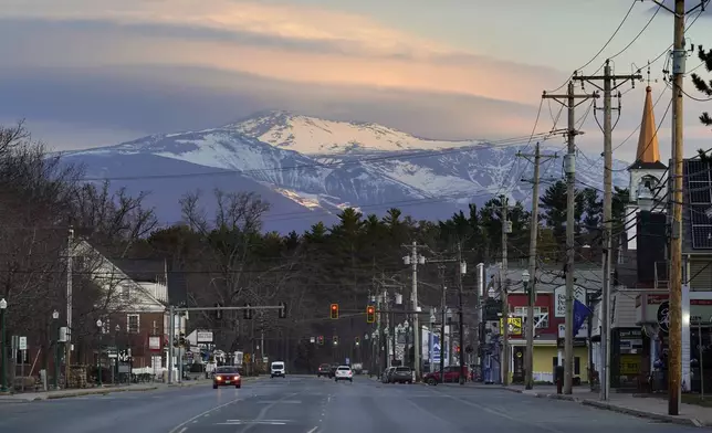 FILE - Mount Washington dominates the scene in this view of the business district in the village of North Conway, N.H., Thursday, April 13, 2023. (AP Photo/Robert F. Bukaty, File)
