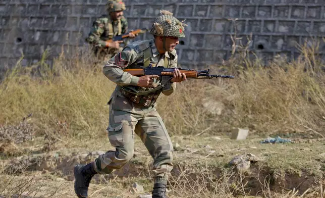 FILE - Indian army soldiers conduct a search operation in a forest area outside the Pathankot air force base in Pathankot, India, Sunday, Jan. 3, 2016. (AP Photo/Channi Anand, File)