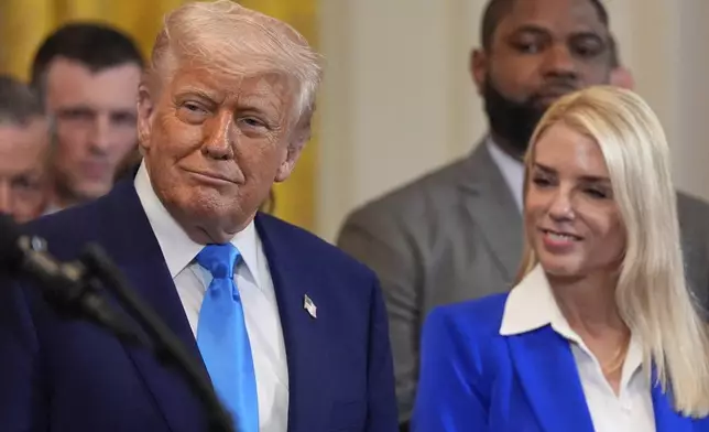 President Donald Trump and Attorney General Pam Bondi listen as head coach Todd Golden speaks as Trump hosts the 2025 NCAA Champion, University of Florida men's basketball team in the East Room of the White House, Wednesday, May 21, 2025, in Washington. (AP Photo/Julia Demaree Nikhinson)