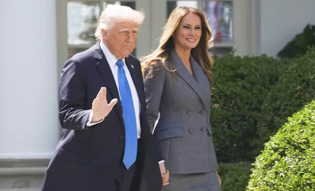 President Donald Trump and first lady Melania Trump arrive in the Rose Garden at the White House, Monday, May 19, 2025 in Washington, where President Trump will sign the "Take It Down Act". (AP Photo/Manuel Balce Ceneta)