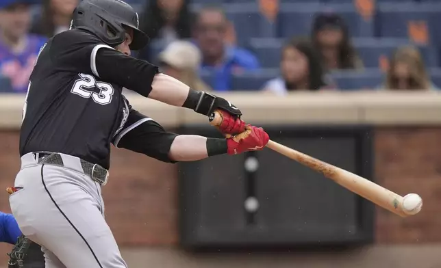 Chicago White Sox's Andrew Benintendi hits an RBI triple during the sixth inning of a baseball game against the New York Mets Wednesday, May 28, 2025, in New York. (AP Photo/Frank Franklin II)