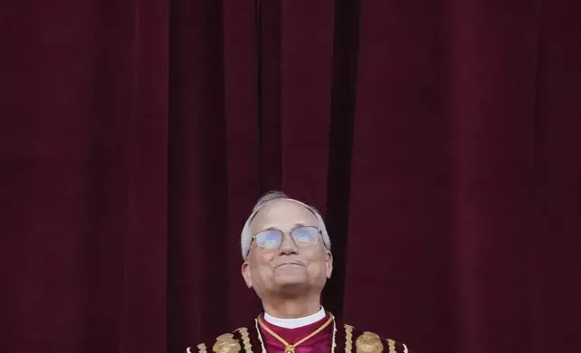 Newly elected Pope Leo XIV appears at the balcony of St. Peter's Basilica at the Vatican, Thursday, May 8, 2025. (AP Photo/Alessandra Tarantino)