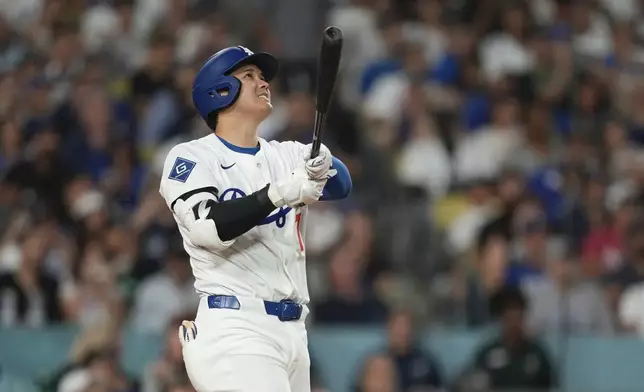Los Angeles Dodgers' Shohei Ohtani hits a solo home run during the sixth inning of a baseball game against the New York Yankees, Friday, May 30, 2025, in Los Angeles. (AP Photo/Mark J. Terrill)