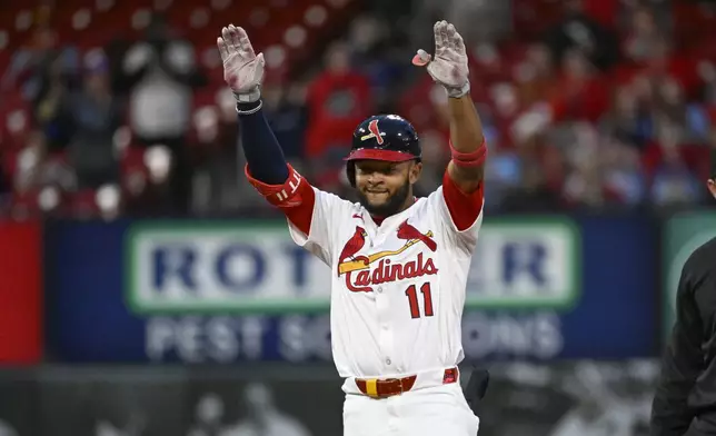 St. Louis Cardinals' Victor Scott II celebrates after hitting an RBI double in the sixth inning during the second baseball game of a doubleheader against the New York Mets, Sunday, May 4, 2025, in St. Louis. (AP Photo/Joe Puetz)