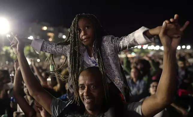 Fans cheer as they watch Lady Gaga free concert on Copacabana beach, in Rio de Janeiro, Saturday, May 3, 2025. (AP Photo/Bruna Prado)