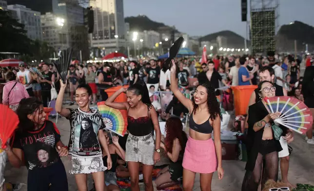 Fans cheer as they wait for the start of Lady Gaga's free concert on Copacabana beach in Rio de Janeiro, Saturday, May 3, 2025. (AP Photo/Bruna Prado)