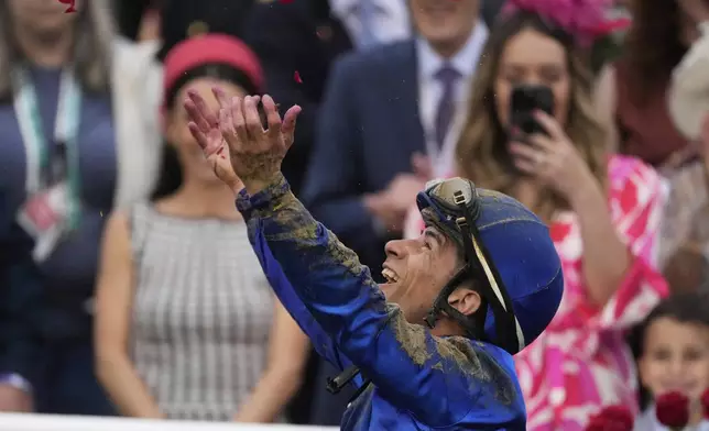 Junior Alvarado celebrates after riding Sovereignty to victory in the 151st running of the Kentucky Derby horse race at Churchill Downs Saturday, May 3, 2025, in Louisville, Ky. (AP Photo/Brynn Anderson)