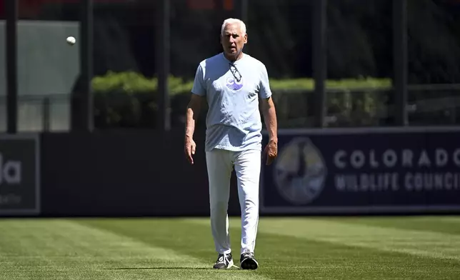 Colorado Rockies manager Bud Black walks off the field prior to a baseball game against the San Diego Padres, Sunday, May 11, 2025, in Denver. Black was fired as manager immediately following the game. (AP Photo/Geneva Heffernan)