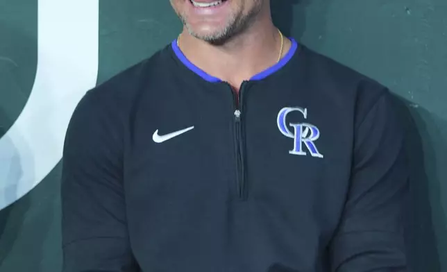 Colorado Rockies interim manager Warren Schaeffer sits in the dugout before a baseball game against the Texas Rangers, Monday, May 12, 2025, in Arlington, Texas. (AP Photo/LM Otero)