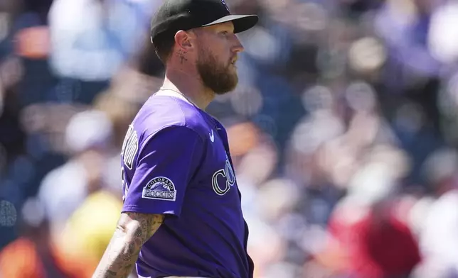 Colorado Rockies starting pitcher Kyle Freeland reacts after Detroit Tigers' Javier Báez scored on an error during the third inning in the first baseball game of a doubleheader Thursday, May 8, 2025, in Denver. (AP Photo/David Zalubowski)