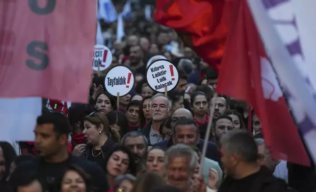 Several thousand Turkish Cypriots took to the streets of the northern half of ethnically divided Cyprus' capital Nicosia to protest what they say is Turkey's attempt to erode their secular roots and to strengthen the hold of political Islam over their society, on Friday, May 2, 2025. (AP Photo/Petros Karadjias)