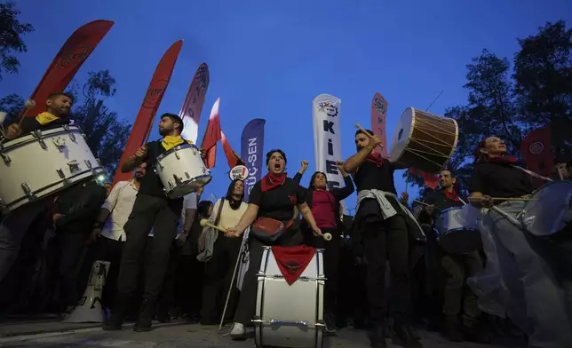 Several thousand Turkish Cypriots took to the streets of the northern half of ethnically divided Cyprus' capital Nicosia to protest what they say is Turkey's attempt to erode their secular roots and to strengthen the hold of political Islam over their society, on Friday, May 2, 2025. (AP Photo/Petros Karadjias)