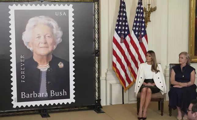 First lady Melania Trump, seated left, and Dorothy Bush Koch look on after unveiling a U.S. Postal Service Stamp honoring former first lady Barbara Bush, Thursday, May 8, 2025, in the East Room of the White House in Washington. (AP Photo/Jacquelyn Martin)