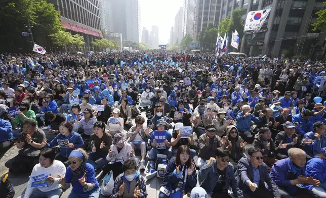 Supporters of Lee Jae-myung, presidential candidate of the Democratic Party, cheer during a campaign event in Seoul, South Korea, Monday, May 12, 2025. (AP Photo/Lee Jin-man)