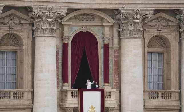 Pope Leo XIV appears at the central balcony of St. Peter's Basilica for his first Sunday blessing after his election, in St. Peter¥s Square at the Vatican, Sunday May 11, 2025. (AP Photo/Alessandra Tarantino)