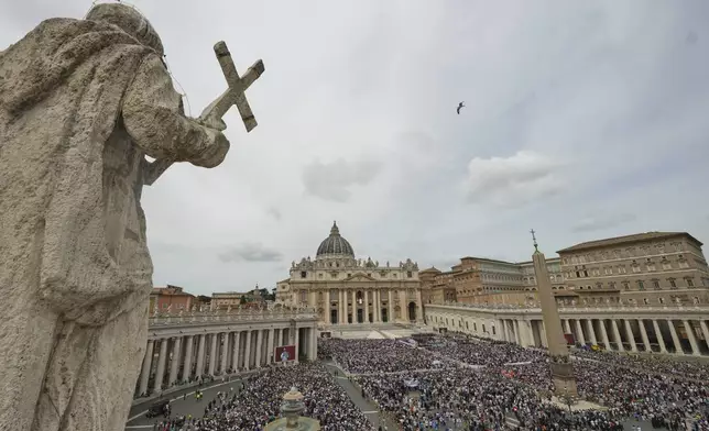 Pope Leo XIV appears at the central balcony of St. Peter's Basilica for his first Sunday blessing after his election, in St. Peter¥s Square at the Vatican, Sunday May 11, 2025. (AP Photo/Alessandra Tarantino)