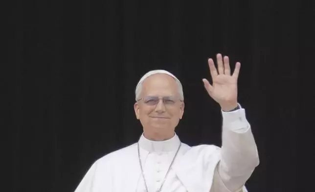 Pope Leo XIV appears at the central balcony of St. Peter's Basilica for his first Sunday blessing after his election, in St. Peter's Square at the Vatican, Sunday, May 11, 2025.(AP Photo/Andrew Medichini)