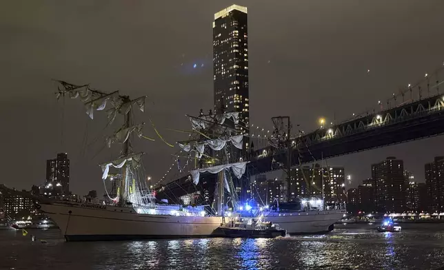 A masted Mexican Navy training ship, the Cuauhtémoc, sits stranded after colliding with the Brooklyn Bridge after, Saturday, May 17, 2025, in New York. (AP Photo/Kyle Viterbo)