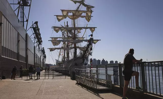 After colliding with the Brooklyn Bridge on Saturday evening, the Cuauhtémoc, a masted Mexican Navy training ship, sits docked at Pier 35 Sunday, May 18, 2025, in New York. (AP Photo/Yuki Iwamura)