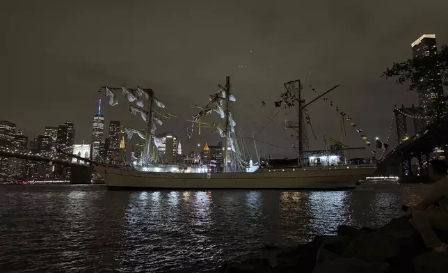 A masted Mexican Navy training ship, the Cuauhtémoc, sits stranded after colliding with the Brooklyn Bridge in New York on Saturday, May 17, 2025. (AP Photo/Kyle Viterbo)