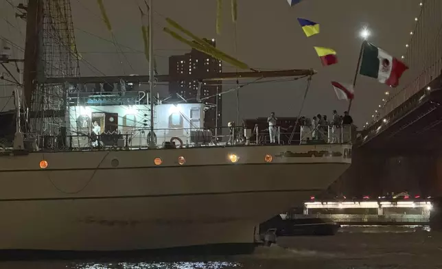 A Mexican navy ship sits in the water after it hit the Brooklyn Bridge on Saturday, May 17, 2025 in New York. (AP Photo/Kyle Viterbo)