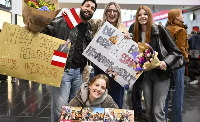 Fans waiting for the arrival of JJ from Austria, at the airport in Vienna, Austria, Sunday, May 18, 2025, after JJ wins the Grand Final of the 69th Eurovision Song Contest, in Basel yesterday. (AP Photo/Denes Erdos)