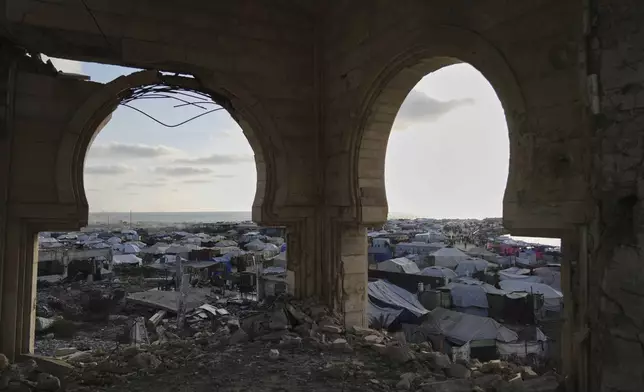 A makeshift tent camp for displaced Palestinians stretches across the port of Gaza City on Thursday, May 22, 2025. (AP Photo/Jehad Alshrafi)