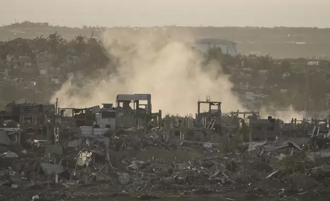 Smoke rises following an Israeli army bombardment in Gaza Strip, seen from southern Israel, Tuesday, May 20, 2025. (AP Photo/Maya Alleruzzo)