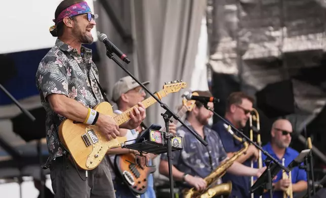 The Honey Island Swamp Band performs at the New Orleans Jazz &amp; Heritage Festival in New Orleans, Friday, April 25, 2025. (AP Photo/Gerald Herbert)