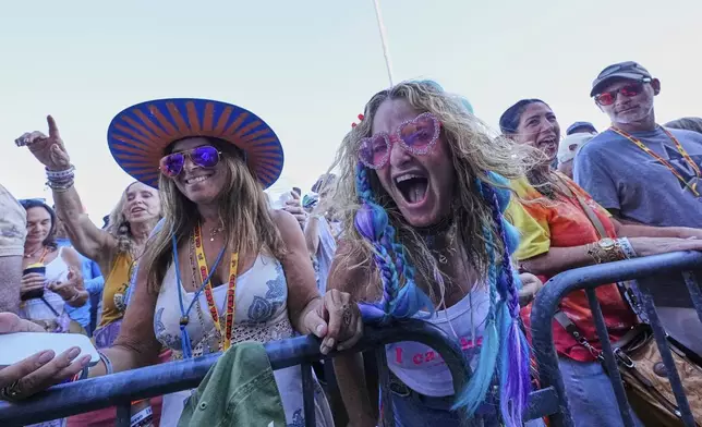 Fans react as My Morning Jacket performs at the New Orleans Jazz &amp; Heritage Festival in New Orleans, Sunday, May 4, 2025. (AP Photo/Gerald Herbert)
