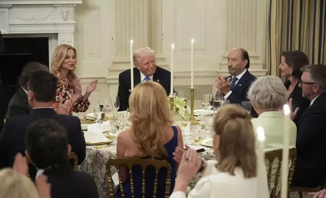 President Donald Trump attends a Kennedy Center board dinner in the State Dining Room at the White House, Monday, May 19, 2025, in Washington. (AP Photo/Manuel Balce Ceneta)