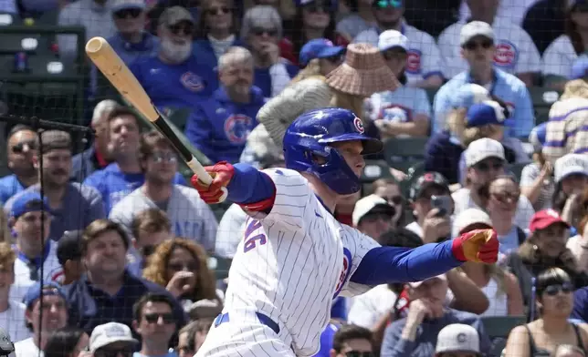 Chicago Cubs' Pete Crow-Armstrong hits a two-run single against the Chicago White Sox during the second inning of a baseball game Saturday, May 17, 2025, in Chicago. (AP Photo/David Banks)