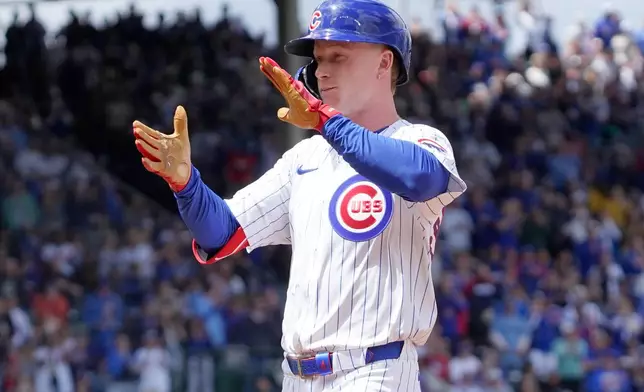 Chicago Cubs' Pete Crow-Armstrong reacts after hitting a two-run single against the Chicago White Sox during the second inning of a baseball game Saturday, May 17, 2025, in Chicago. (AP Photo/David Banks)