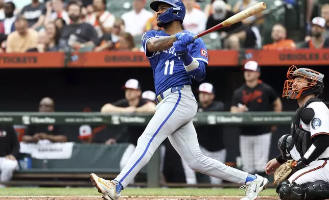 Kansas City Royals' Maikel Garcia hits a home run during the second inning of a baseball game against the Baltimore Orioles, Sunday, May 4, 2025, in Baltimore. (AP Photo/Daniel Kucin Jr.)