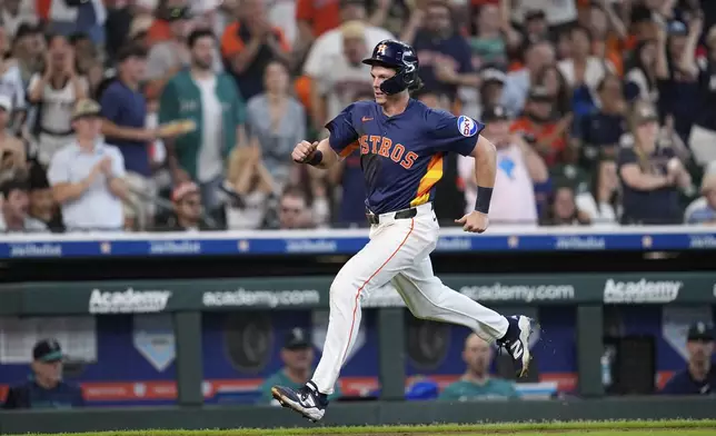 Houston Astros' Jake Meyers runs down the third base line to score against the Seattle Mariners during the sixth inning of a baseball game Sunday, May 25, 2025, in Houston. (AP Photo/David J. Phillip)
