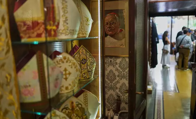 A painting hangs inside the dressing room of the Gammarelli Ecclesiastic clothes tailor shop in Rome, Wednesday, April 30, 2025. (AP Photo/Francisco Seco)