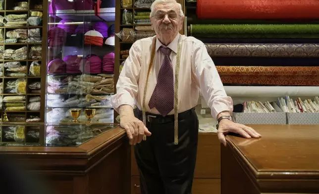 Italian tailor Raniero Mancinelli ,who on his own initiative is making outfits for a possible future Pope, is interviewed by the Associated Press inside his shop in Rome, Wednesday, April 30, 2025. (AP Photo/Gregorio Borgia)