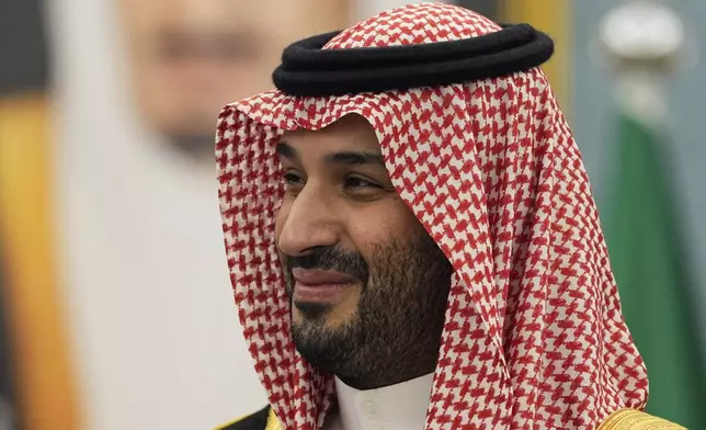 Saudi Crown Prince Mohammed bin Salman joins President Donald Trump to greet delegations at the Royal Palace in Riyadh, Saudi Arabia, Tuesday, May 13, 2025. (AP Photo/Alex Brandon)