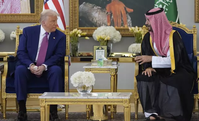 President Donald Trump speaks with Saudi Crown Prince Mohammed bin Salman during a coffee ceremony at the Royal Terminal of King Khalid International Airport in Riyadh, Saudi Arabia, Tuesday, May 13, 2025. (AP Photo/Alex Brandon)