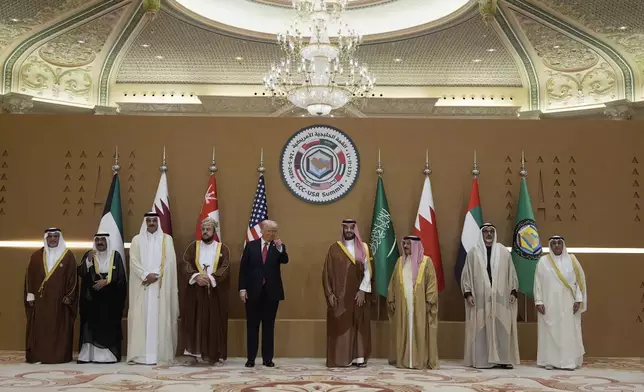 President Donald Trump, fifth left, attends a group photo session with Saudi Crown Prince Mohammed bin Salman, fourth right, with United Arab Emirates Crown Prince Sheikh Khaled bin Mohamed bin Zayed Al Nahyan, second right, Bahrain's Crown Prince and Prime Minister Salman bin Hamad Al Khalifa, left, Qatar's Emir Sheikh Tamim bin Hamad Al Thani, third left, Kuwait's Crown Prince Mishal Al-Ahmad Al-Jaber Al-Sabah, second left, Gulf Cooperation Council Secretary-General Jasem Mohamed Albudaiwi, right, during the GCC Summit in Riyadh, Saudi Arabia, Wednesday, May 14, 2025. (AP Photo/Alex Brandon)