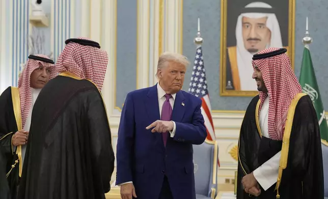 President Donald Trump and Saudi Crown Prince Mohammed bin Salman speaks as they meet delegations during an arrival ceremony at the Royal Palace in Riyadh, Saudi Arabia, Tuesday, May 13, 2025. (AP Photo/Alex Brandon)