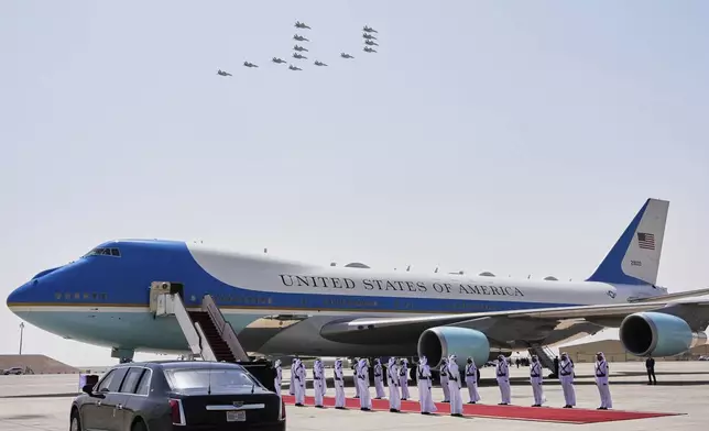 Qatar Air Force F-15 jets perform a flyover as Air Force One is ready to depart from Al Udeid Air Base, Thursday, May 15, 2025, in Doha, Qatar. (AP Photo/Alex Brandon)
