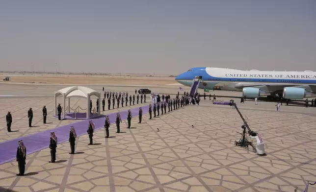 President Donald Trump walks with Saudi Crown Prince Mohammed bin Salman during an arrival ceremony at the Royal Terminal of King Khalid International Airport in Riyadh, Saudi Arabia, Tuesday, May 13, 2025.(AP Photo/Alex Brandon)
