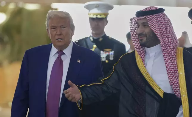 Saudi Crown Prince Mohammed bin Salman welcomes President Donald Trump during an arrival ceremony at the Royal Terminal of King Khalid International Airport in Riyadh, Saudi Arabia, Tuesday, May 13, 2025.(AP Photo/Alex Brandon)