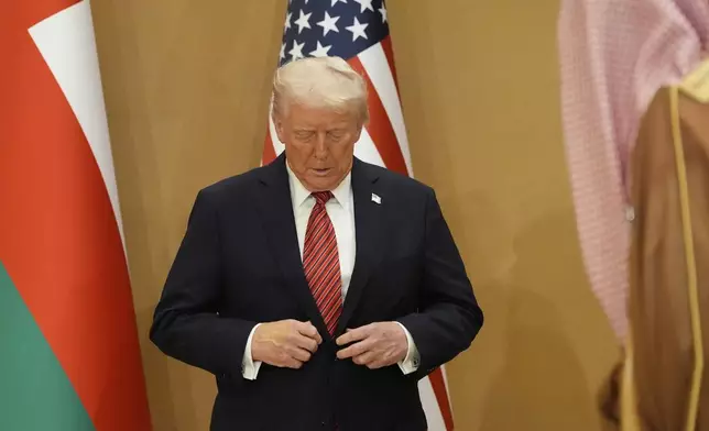 President Donald Trump arrives for the group photo with Gulf Cooperation Council leaders during the GCC Summit in Riyadh, Saudi Arabia, Wednesday, May 14, 2025. (AP Photo/Alex Brandon)
