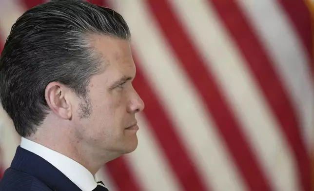 U.S. ecretary of Defense Pete Hegseth attends along with President Donald Trump a business roundtable, Thursday, May 15, 2025, in Doha, Qatar. (AP Photo/Alex Brandon)