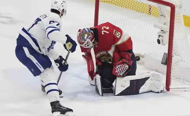 Toronto Maple Leafs left wing Max Pacioretty (67) scores a goal past Florida Panthers goaltender Sergei Bobrovsky (72) during the third period in Game 6 of a second-round NHL hockey playoff series, Friday, May 16, 2025, in Sunrise, Fla. (AP Photo/Lynne Sladky)
