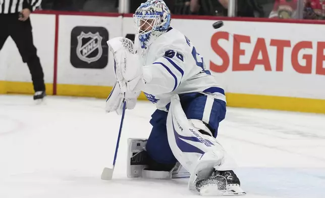 Toronto Maple Leafs goaltender Joseph Woll (60) defends the goal during the first period in Game 6 of a second-round NHL hockey playoff series against the Florida Panthers, Friday, May 16, 2025, in Sunrise, Fla. (AP Photo/Lynne Sladky)