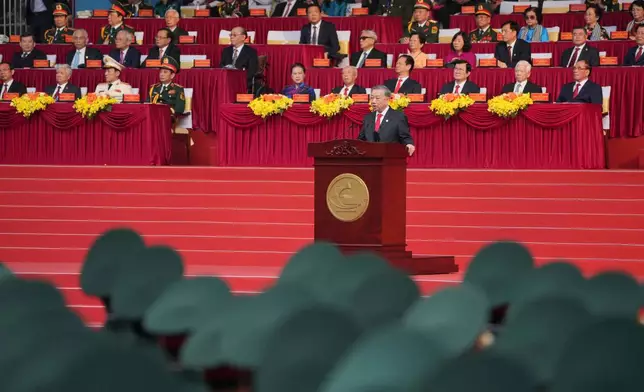 Vietnam Communist Party General Secretary To Lam, center, delivers his speech during the 50th anniversary of the end of the Vietnam War in Ho Chi Minh City, Vietnam, Wednesday, April 30, 2025. (AP Photo/Achmad Ibrahim)