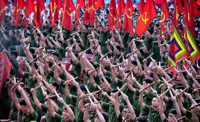 Vietnamese drummers perform during a parade celebrating the 50th anniversary of the end of the Vietnam War on Wednesday, April 30, 2025, in Ho Chi Minh City, Vietnam. (AP Photo/Richard Vogel)